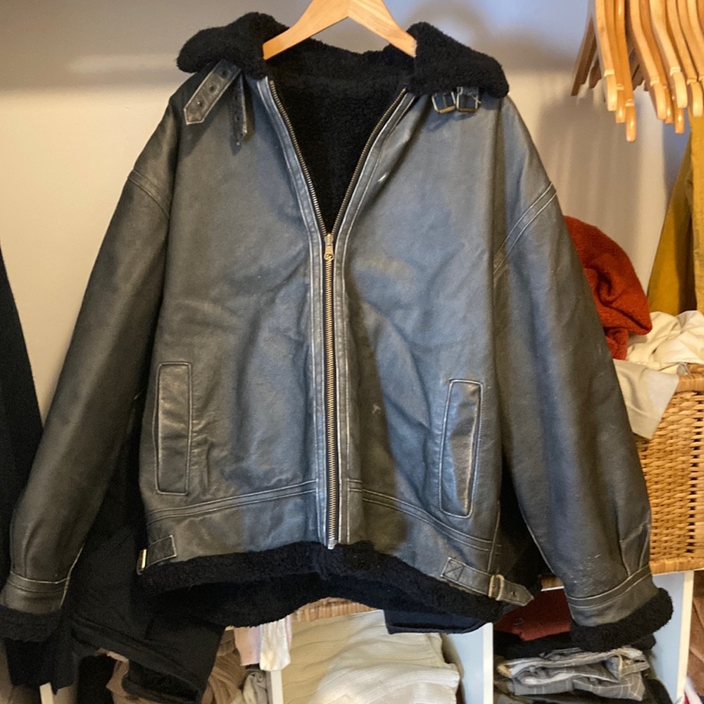 Dark leather jacket with black fur
